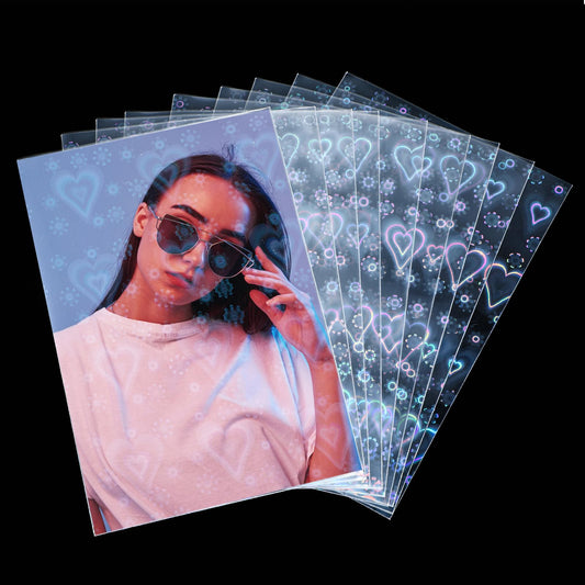 AOZUO Pack of 100 Laser Card Sleeves, Photocard Sleeves, 61 x 88 mm Kpop Photocard Soft Sleeves Photo Card Sleeves Transparent Card Protector Film Photo Card Case for Trading Cards Photo Cards (Heart)